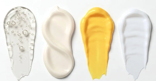 A photo of 4 textures of skincare A Pineapple and Papaya Enzyme Mask, Face Cream, Beauty Balm, and Serum