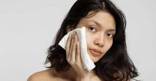 A photo of a teen using a makeup wipe