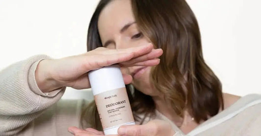 A photo of Ashley, a Simple Body customer holding up a Simple Body All-Natural Deodorant in Citrus Burst.