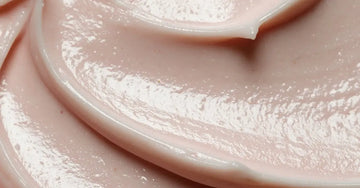 A closeup photo of a beige colored lotion representing the Simple Body Barrier Defense Serum Ceramide Complex