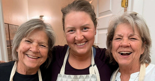 Three beautiful women in perimenopause and post menopause showing off their beautiful skin in aprons.