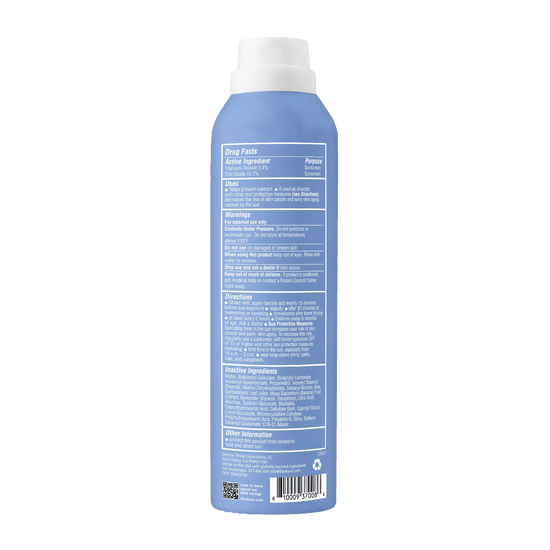 Blue sunscreen bottle with a white cap on a white background