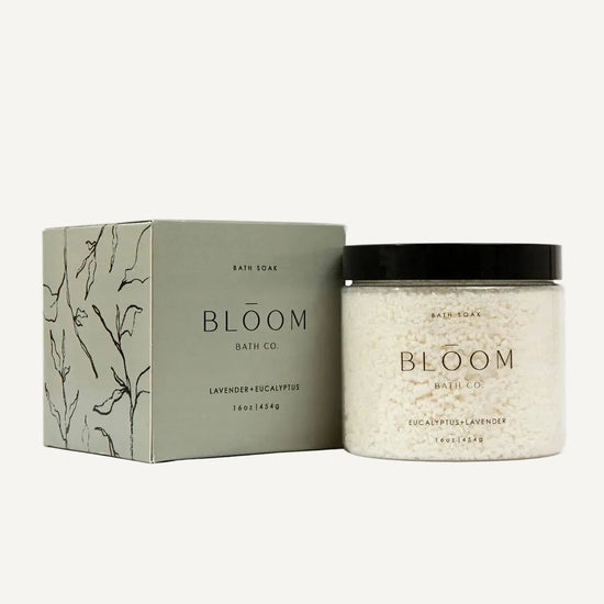 Eucalyptus and Lavender Bloom Bath Co. Bath soak product packaging on a white background