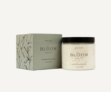 Eucalyptus and Lavender Bloom Bath Co. Bath soak product packaging on a white background