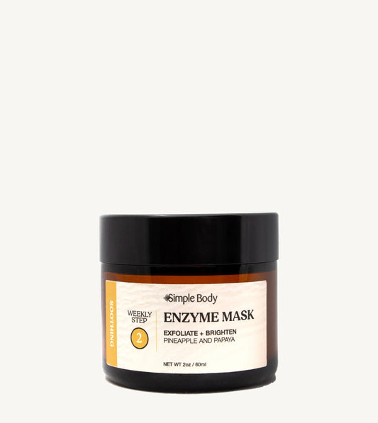 A jar of Simple Body Enzyme Mask, Papaya & Pineapple, designed for exfoliating and brightening the skin. The jar is recyclable glass with a black lid and a label that includes the product name and a brief description.