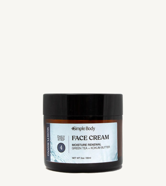 A recyclable glass jar of Simple Body Face Cream with a black lid and a label that includes the product name and a brief description.