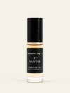 A clear glass bottle of Santal 37 perfume oil from Benjamin Soap Cowith a black cap and a black label, set against a solid off-white background.