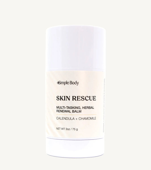 A white container of Simple Body Skin Rescue balm, labeled as multipurpose herbal balm for stressed skin.