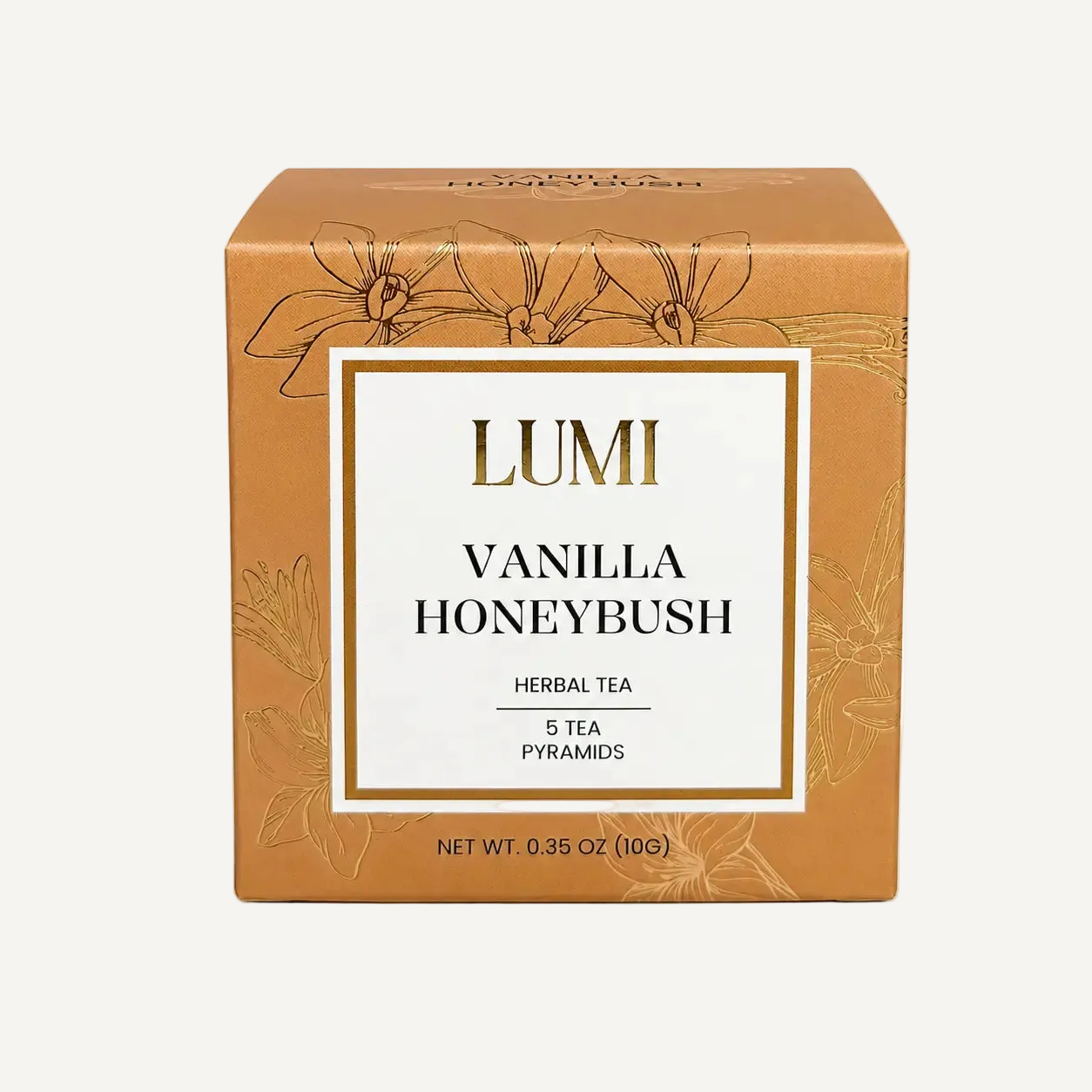 A square cardboard box of Lumi Vanilla Honeybush herbal tea, featuring a warm tan-brown color with gold floral line art and a central white label with gold and black text.