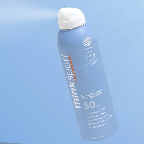 thinksport sunscreen spray bottle on a light blue background