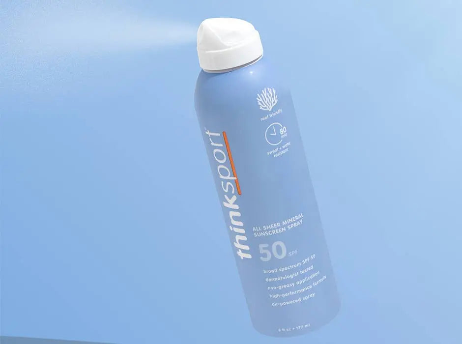 thinksport sunscreen spray bottle on a light blue background