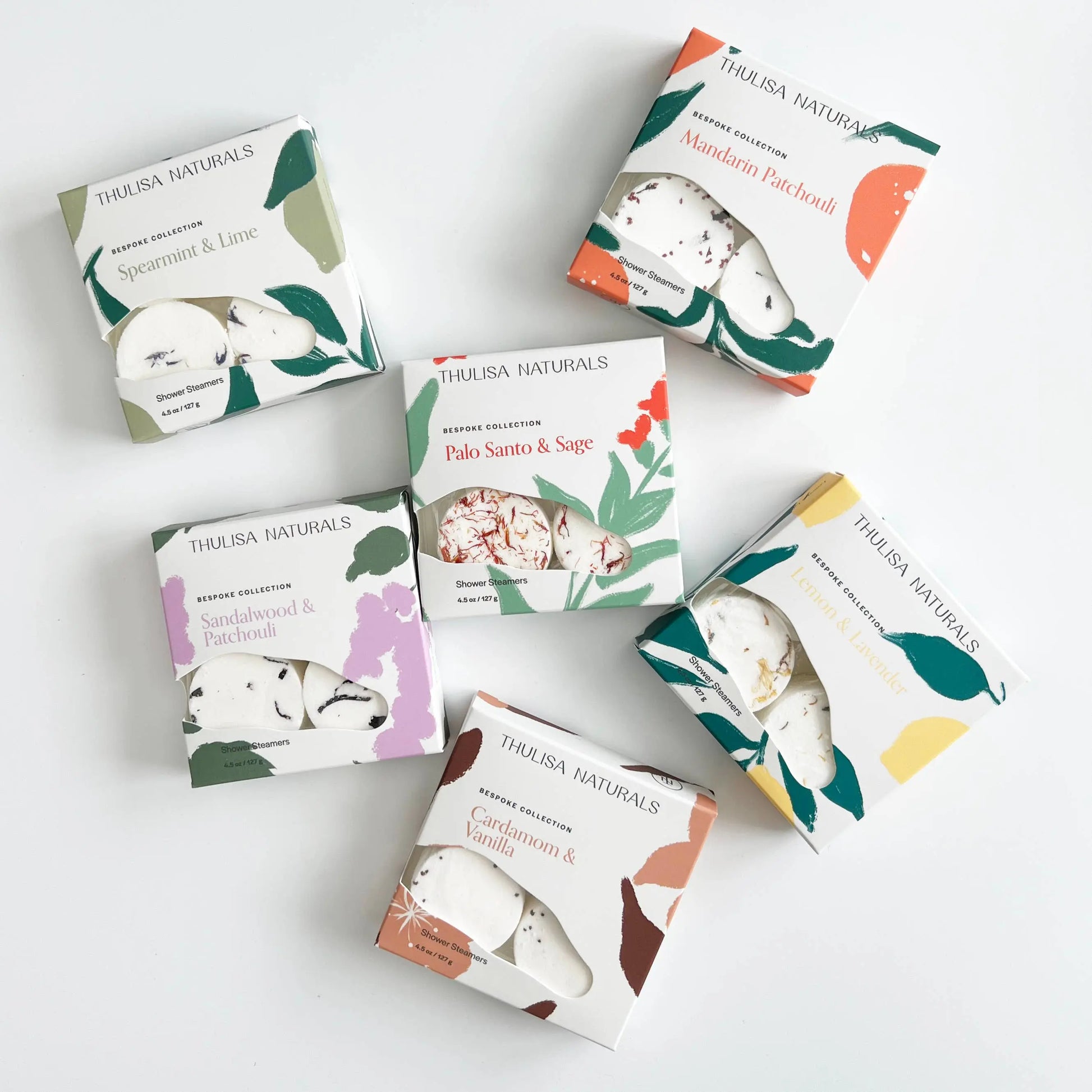 Collection of Thulisa Naturals Shower Steamer Gift boxes on a white background