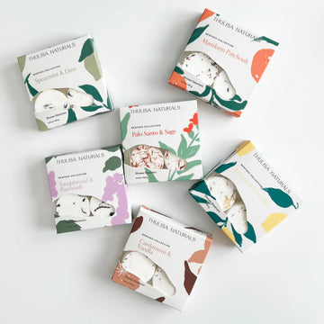 Collection of Thulisa Naturals Shower Steamer Gift boxes on a white background