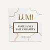 LUMI Vanilla Sea Salt Caramels packaging box, featuring a white background with elegant gold wavy lines and gold lettering.