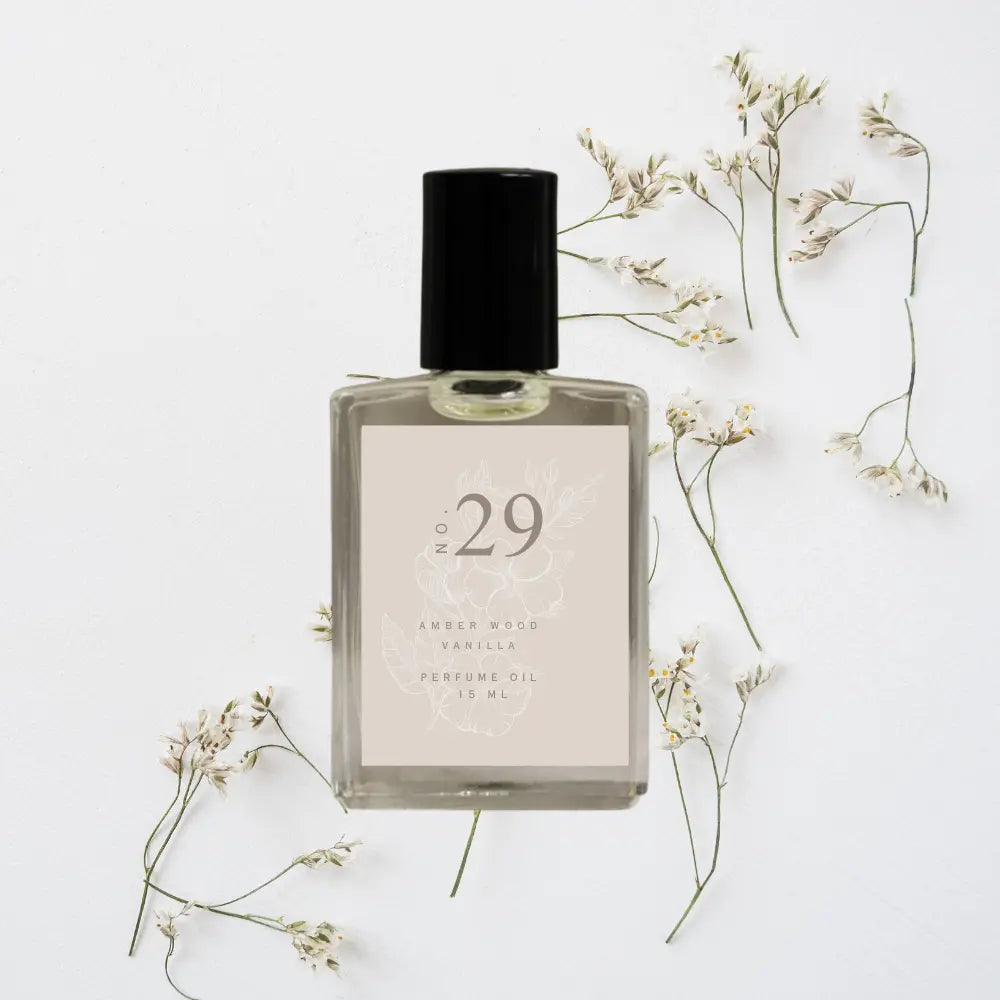 Perfume bottle labeled 'No. 29' with dried flowers on a light background