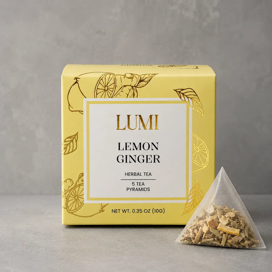 Lumi Lemon Ginger herbal tea package with a pyramid tea bag on a gray background