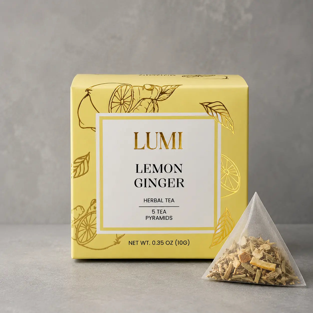Lumi Lemon Ginger herbal tea package with a pyramid tea bag on a gray background