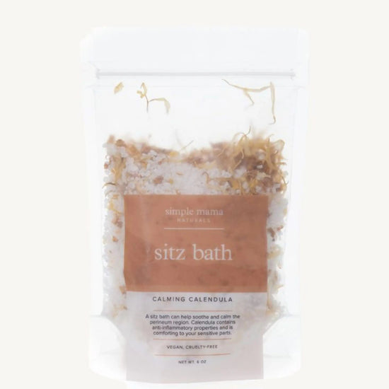A package of Simple Mama Sitz Bath Calming Calendula, with visible natural botanicals inside a clear plastic bag.
