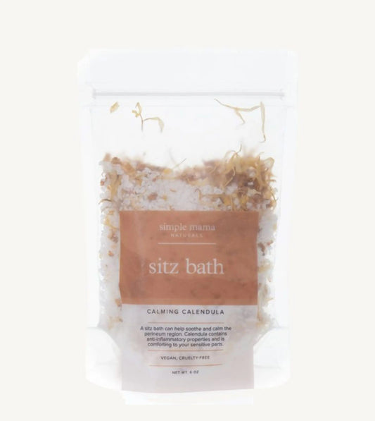 A package of Simple Mama Sitz Bath Calming Calendula, with visible natural botanicals inside a clear plastic bag.