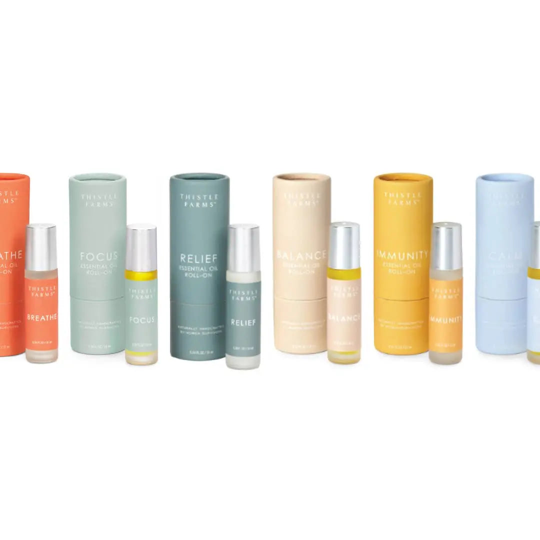 Collection of Thistle & Fern essential oil products on a white background