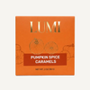 LUMI Pumpkin Spice Caramels packaging box in orange with gold foil lettering and pumpkin illustrations, shown on a white background.