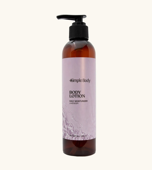 Simple Body amber bottle of Simple Body body lotion in Lavender on a tan background