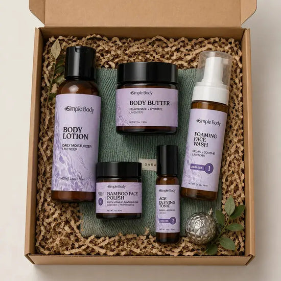 A gift box with a Simple Body Travel Lotion, Body Butter, Bamboo Face Polish, Age Defying Tonic and Foaming Face Wash on top of a green corduroy Cosmetic Bag.