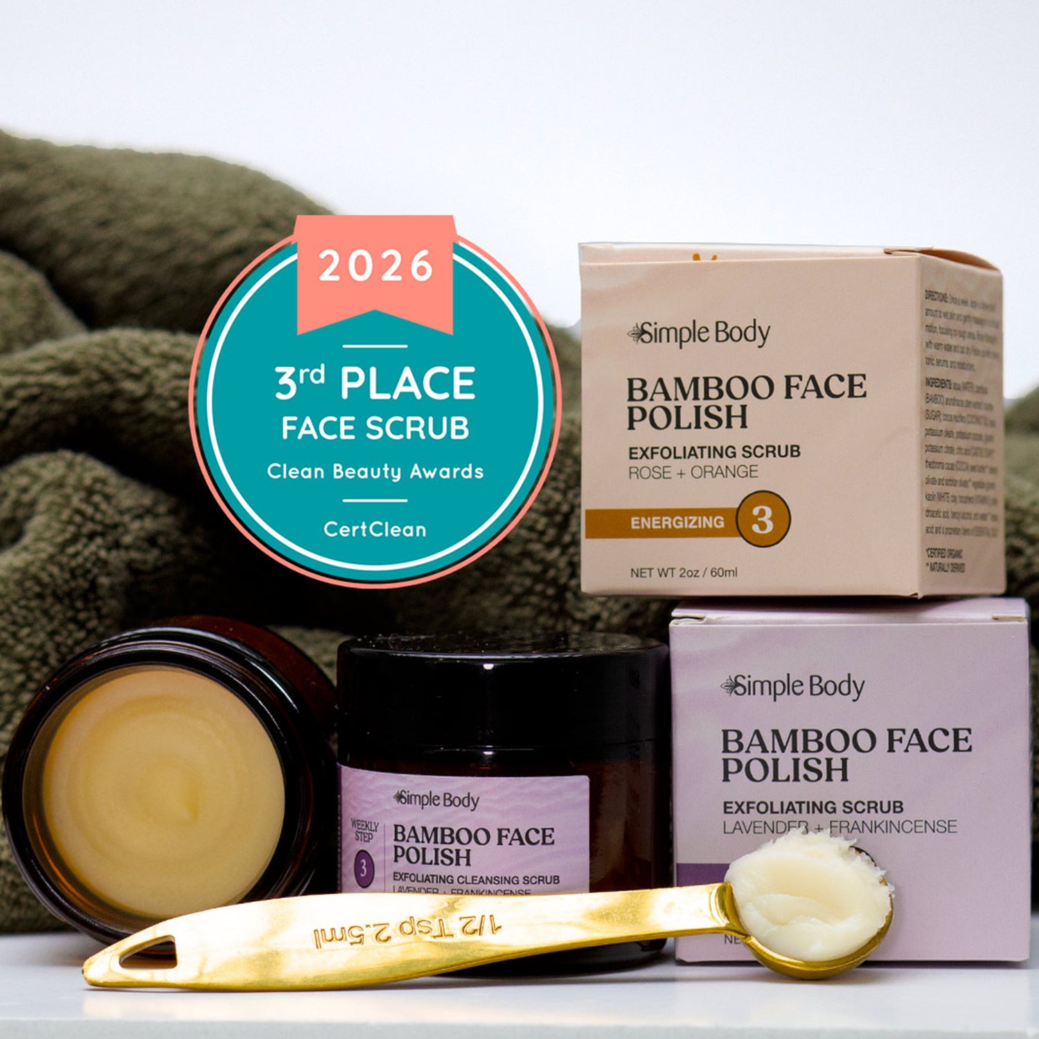 Simple Body bamboo face polish products with awards on a white background