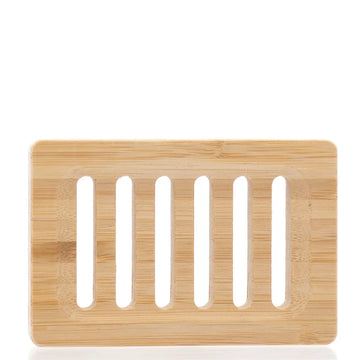 Bamboo soap dish with slotted design on a white background