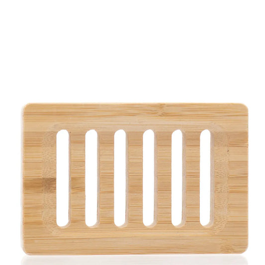 Bamboo soap dish with slotted design on a white background