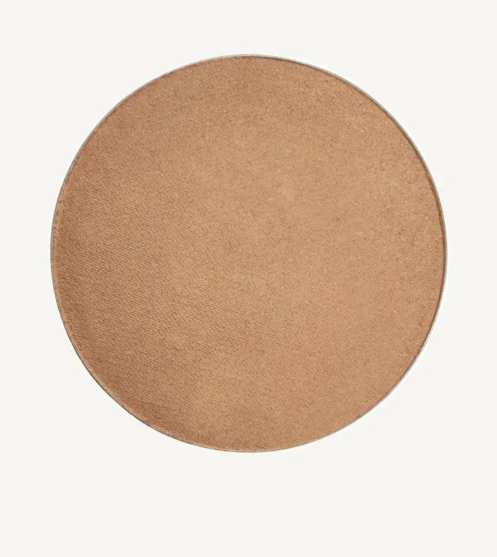 A round image of Pure Anada's Bronzed Clove Cheek color and Bonzer which is a medium beige tan.