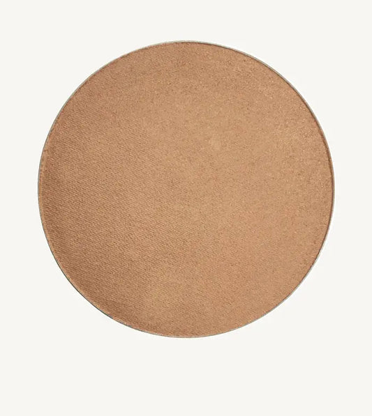 A round image of Pure Anada's Bronzed Clove Cheek color and Bonzer which is a medium beige tan.