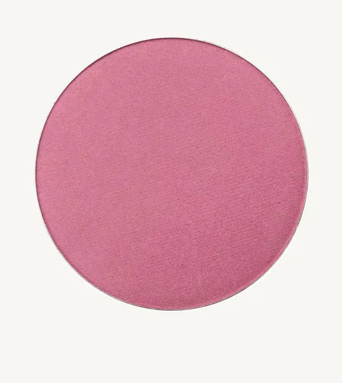 Round Rosey-Pink Shimmery Blush from Pure Anada on a tan background