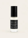 A clear glass bottle of Grapefruit Sage perfume oil by Benjamin Soap Co. with a black cap and a black label, shown against a solid light beige background. 