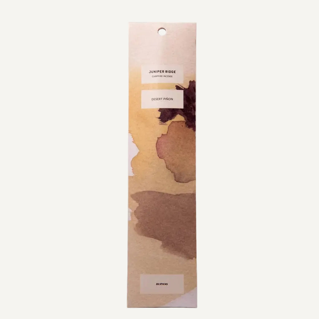 Juniper Ridge Campfire Incense iin Desert Pinon with a watercolor floral design package on a white background