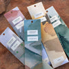 Set of Juniper Ridge Campfire Incense in a variety of scents on a wooden surface