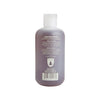 A bottle of Juniper Ridge Body Wash shown from the back, featuring a translucent dark purple body and a white flip-top cap on a plain white background.