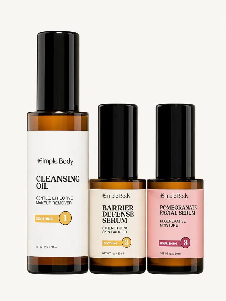 Three Simple Body skincare bottles on a light beige background: Cleansing Oil, Barrier Defense Serum, and Pomegranate Facial Serum.