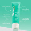 Think Kids sunscreen tube on a teal background with text highlighting features