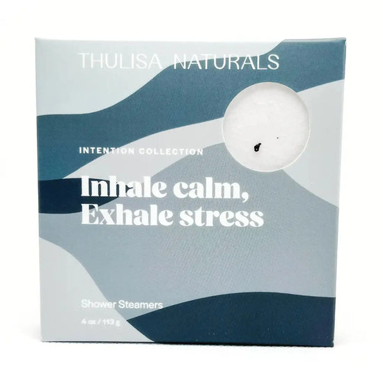 A photo of a box with blue organic shapes on it that has Thulisa Naturals, Intention Collection, Inhale calm, Exhale stress shower steamers on it on a white background
