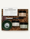 Simple Body Mask gift set in a white box filled with brown crinkle paper. The set includes three jars of clay masks (French Caramel Clay Mask, White Kaolin Clay Mask, and French Green Clay Mask), a dark green bowl, a makeup brush, and an instruction card.