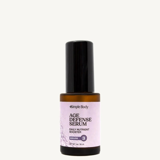 Age defense serum bottle with black cap and purple label on a white background