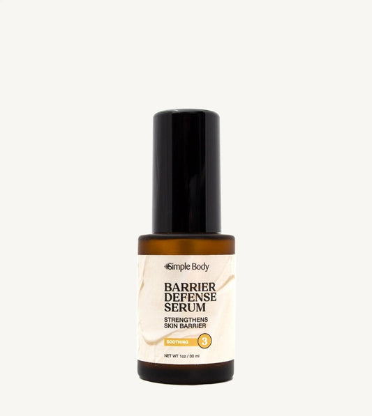 Barrier Defense Serum bottle on a tan background