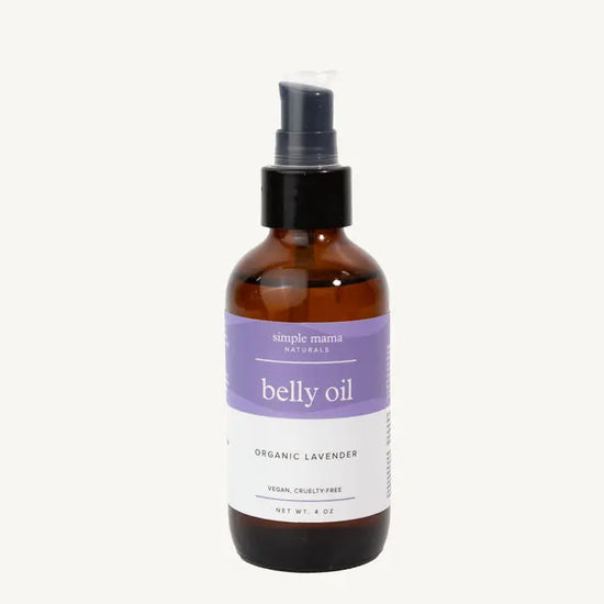 Bottle of Simple Mama belly oil in Lavender with a purple label on a tan background