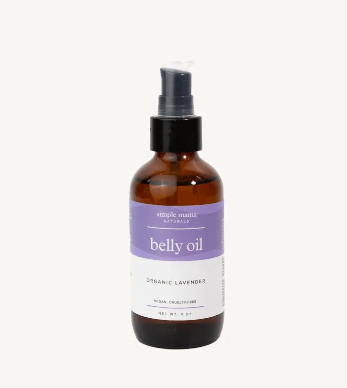 Bottle of Simple Mama belly oil in Lavender with a purple label on a tan background