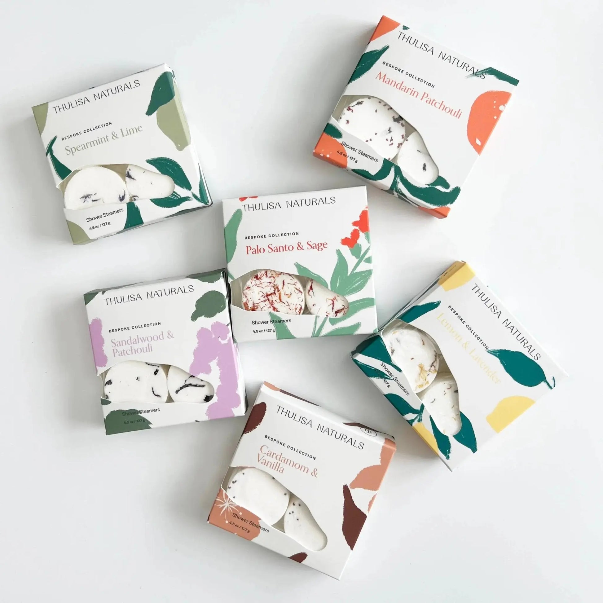 Collection of Thulisa Naturals Shower Steamer Gift boxes on a white background