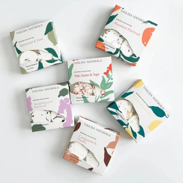 Collection of Thulisa Naturals Shower Steamer Gift boxes on a white background