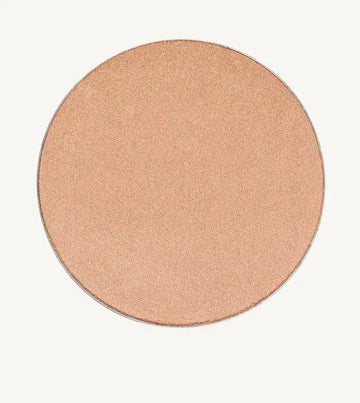 A photo of Pure Anada's Cheek Color in Afterglow which is a creamy champagne color and round.