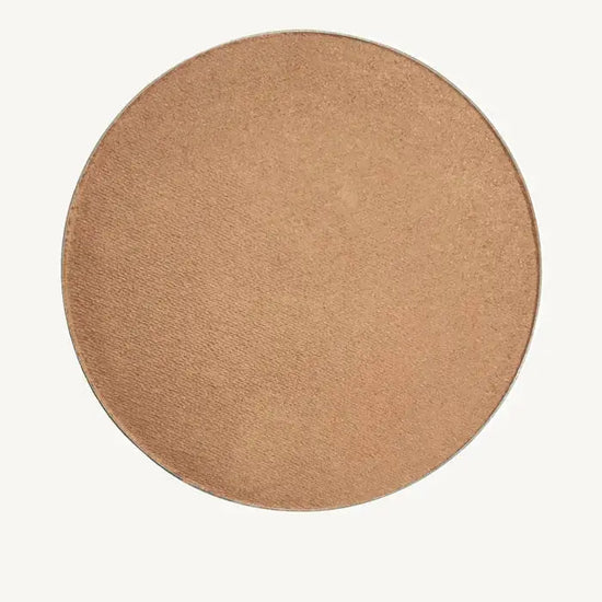 A round image of Pure Anada's Bronzed Clove Cheek color and Bonzer which is a medium beige tan.