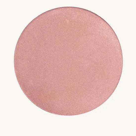 Round Pink image of Pure Anada Sweet Pea Cheek Color that has a rosey-pink, shimmery hue to it.